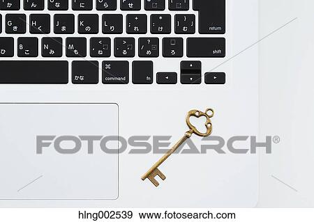 Key and laptop View Large Photo Image Stock Photo - Key and laptop. Fotosearch