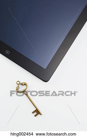 Key and tablet View Large Photo Image Picture - Key and tablet. Fotosearch