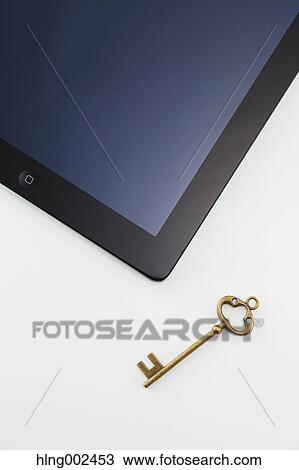 Key and tablet View Large Photo Image Stock Image - Key and tablet. Fotosearch