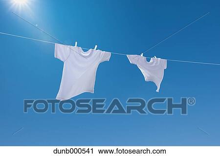 Laundry drying up on washing line View Large Photo Image Stock Image - Laundry drying up on washing line. Fotosearch