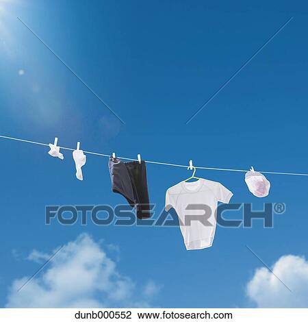 Laundry drying up on washing line View Large Photo Image Stock Image - Laundry drying up on washing line. Fotosearch