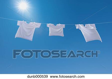 Laundry drying up on washing line View Large Photo Image Stock Photo - Laundry drying up on washing line. Fotosearch