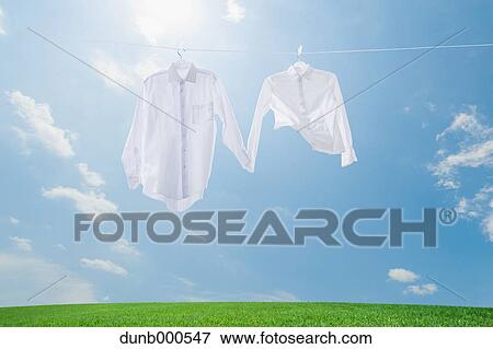 Laundry drying up on washing line View Large Photo Image Stock Photo - Laundry drying up on washing line. Fotosearch