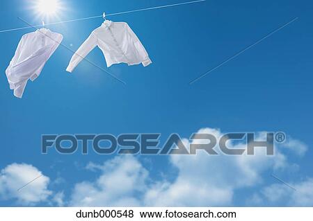 Laundry drying up on washing line View Large Photo Image Stock Photo - Laundry drying up on washing line. Fotosearch
