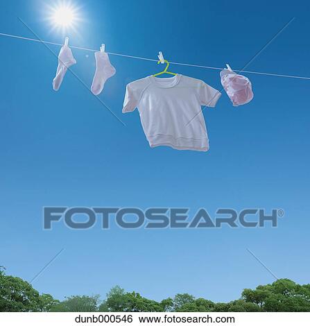 Laundry drying up on washing line View Large Photo Image Stock Photograph - Laundry drying up on washing line. Fotosearch