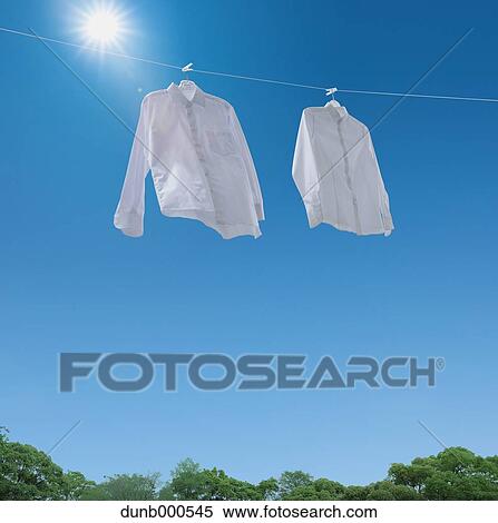 Laundry drying up on washing line View Large Photo Image Stock Photography - Laundry drying up on washing line. Fotosearch