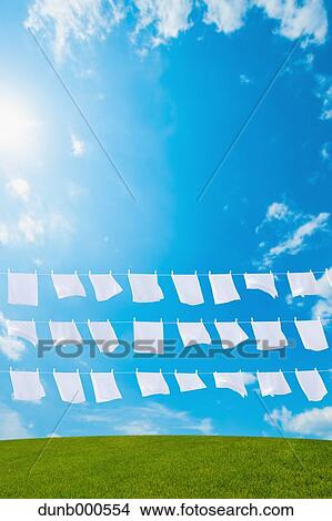Laundry drying up on washing lines View Large Photo Image Picture - Laundry drying up on washing lines. Fotosearch