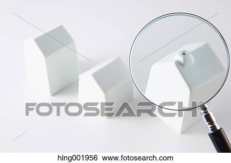 Model house and magnifying glass View Large Photo Image Stock Photograph - Model house and magnifying glass. Fotosearch