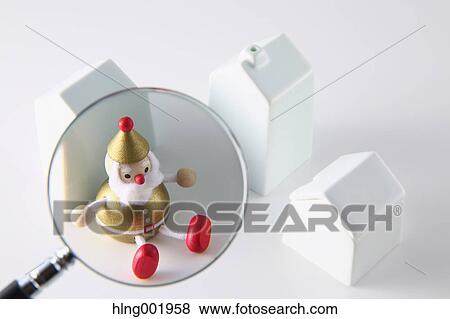 Model house Christmas decoration and magnifying glass View Large Photo Image Stock Photo - Model house Christmas decoration and magnifying glass. Fotosearch
