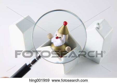 Model house Christmas decoration and magnifying glass View Large Photo Image Stock Photo - Model house Christmas decoration and magnifying glass. Fotosearch