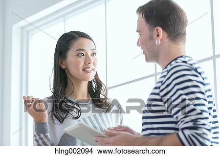 Multi-ethnic business people working in modern office View Large Photo Image Picture - Multi-ethnic business people working in modern office. Fotosearch