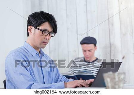 Multi-ethnic business people working in modern office View Large Photo Image Picture - Multi-ethnic business people working in modern office. Fotosearch