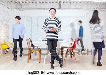 Multi-ethnic business people working in modern office View Large Photo Image Picture - Multi-ethnic business people working in modern office. Fotosearch