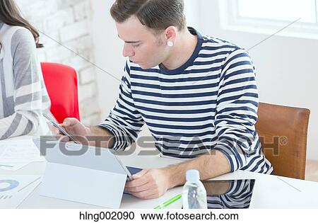 Multi-ethnic business people working in modern office View Large Photo Image Stock Image - Multi-ethnic business people working in modern office. Fotosearch