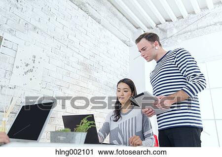 Multi-ethnic business people working in modern office View Large Photo Image Stock Image - Multi-ethnic business people working in modern office. Fotosearch