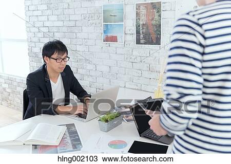Multi-ethnic business people working in modern office View Large Photo Image Stock Image - Multi-ethnic business people working in modern office. Fotosearch