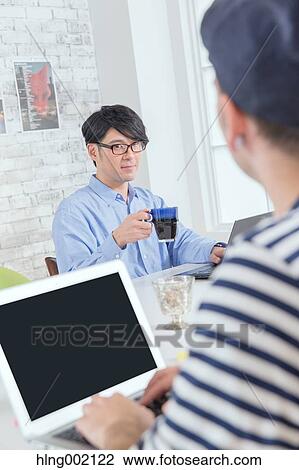 Multi-ethnic business people working in modern office View Large Photo Image Stock Image - Multi-ethnic business people working in modern office. Fotosearch