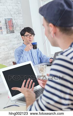 Multi-ethnic business people working in modern office View Large Photo Image Stock Image - Multi-ethnic business people working in modern office. Fotosearch