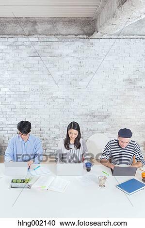 Multi-ethnic business people working in modern office View Large Photo Image Stock Image - Multi-ethnic business people working in modern office. Fotosearch
