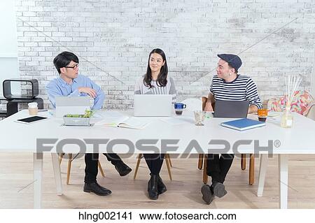 Multi-ethnic business people working in modern office View Large Photo Image Stock Image - Multi-ethnic business people working in modern office. Fotosearch