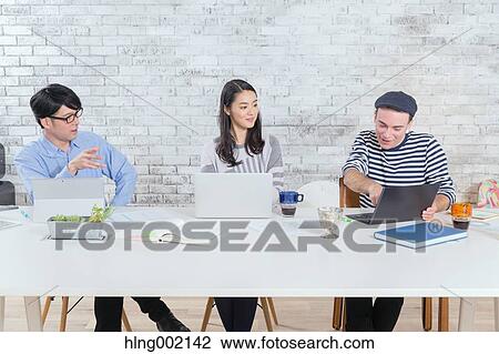 Multi-ethnic business people working in modern office View Large Photo Image Stock Image - Multi-ethnic business people working in modern office. Fotosearch