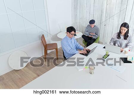 Multi-ethnic business people working in modern office View Large Photo Image Stock Image - Multi-ethnic business people working in modern office. Fotosearch