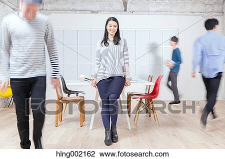 Multi-ethnic business people working in modern office View Large Photo Image Stock Image - Multi-ethnic business people working in modern office. Fotosearch