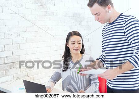 Multi-ethnic business people working in modern office View Large Photo Image Stock Photo - Multi-ethnic business people working in modern office. Fotosearch