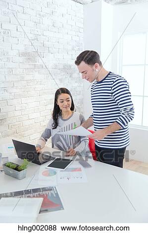 Multi-ethnic business people working in modern office View Large Photo Image Stock Photo - Multi-ethnic business people working in modern office. Fotosearch