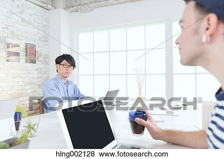 Multi-ethnic business people working in modern office View Large Photo Image Stock Photo - Multi-ethnic business people working in modern office. Fotosearch