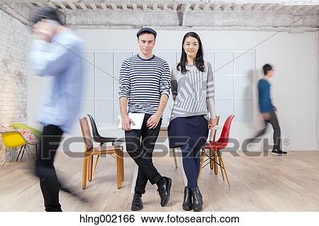 Multi-ethnic business people working in modern office View Large Photo Image Stock Photograph - Multi-ethnic business people working in modern office. Fotosearch