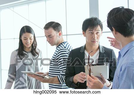 Multi-ethnic business people working in modern office View Large Photo Image Stock Photography - Multi-ethnic business people working in modern office. Fotosearch