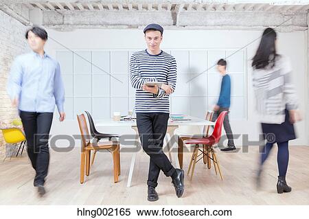 Multi-ethnic business people working in modern office View Large Photo Image Stock Photography - Multi-ethnic business people working in modern office. Fotosearch