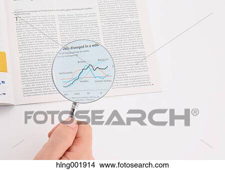 Newspaper and magnifying glass View Large Photo Image Picture - Newspaper and magnifying glass. Fotosearch