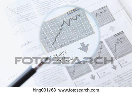 Stock Photo - Newspaper and magnifying glass. Fotosearch