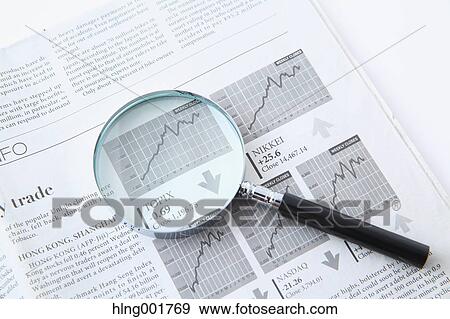 Stock Photo - Newspaper and magnifying glass. Fotosearch
