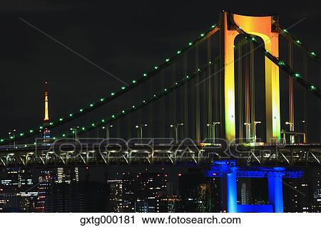 Stock Image - Night view of Rainbow bridge and Tokyo Tower, Tokyo, Japan. Fotosearch