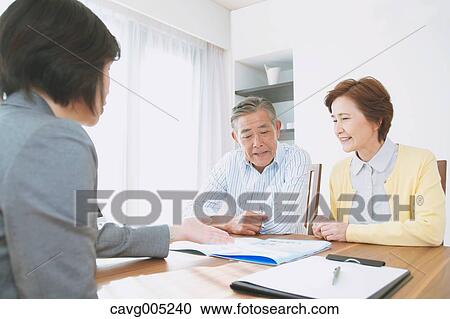 Senior Japanese couple consulting with financial planner View Large Photo Image Stock Image - Senior Japanese couple consulting with financial planner. Fotosearch