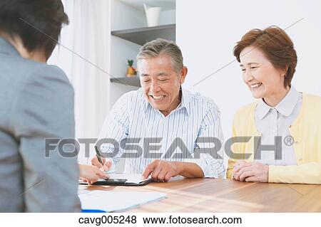 Senior Japanese couple consulting with financial planner View Large Photo Image Stock Photo - Senior Japanese couple consulting with financial planner. Fotosearch