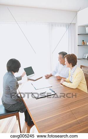 Senior Japanese couple consulting with financial planner View Large Photo Image Stock Photography - Senior Japanese couple consulting with financial planner. Fotosearch