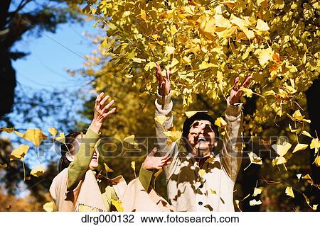 Senior Japanese couple in a city park in Autumn View Large Photo Image Stock Image - Senior Japanese couple in a city park in Autumn. Fotosearch
