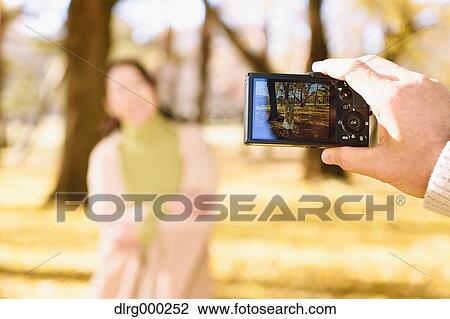 Senior Japanese couple taking pictures in a city park in Autumn View Large Photo Image Stock Image - Senior Japanese couple taking pictures in a city park in Autumn. Fotosearch