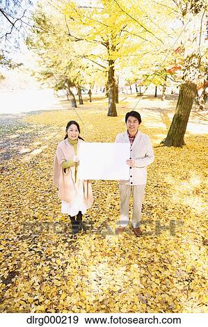Senior Japanese couple with whiteboard in a city park View Large Photo Image Stock Photo - Senior Japanese couple with whiteboard in a city park. Fotosearch