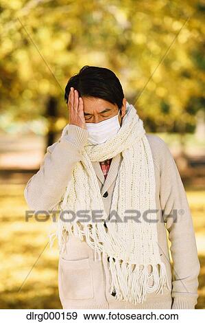 Senior Japanese man with mask feeling sick View Large Photo Image Stock Photo - Senior Japanese man with mask feeling sick. Fotosearch