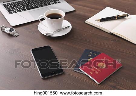 Stock Image - Smartphone coffee and passports. Fotosearch