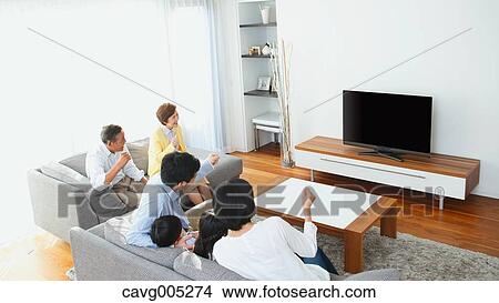 Three-generation Japanese family on the sofa in the living room View Large Photo Image Picture - Three-generation Japanese family on the sofa in the living room. Fotosearch