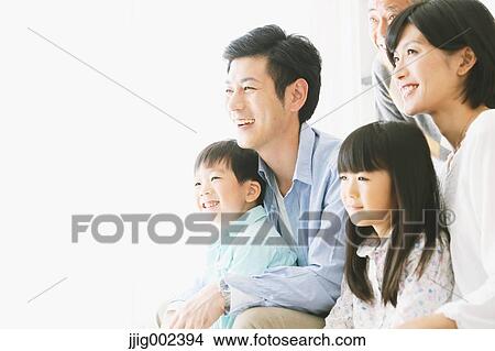Three-generation Japanese family on the sofa in the living room View Large Photo Image Picture - Three-generation Japanese family on the sofa in the living room. Fotosearch