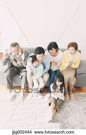 Three-generation Japanese family on the sofa in the living room View Large Photo Image Picture - Three-generation Japanese family on the sofa in the living room. Fotosearch
