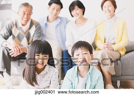 Three-generation Japanese family on the sofa in the living room View Large Photo Image Stock Image - Three-generation Japanese family on the sofa in the living room. Fotosearch