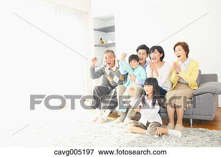 Stock Photo - Three-generation Japanese family on the sofa in the living room. Fotosearch